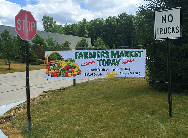 completed over the road  banner installation between two poles